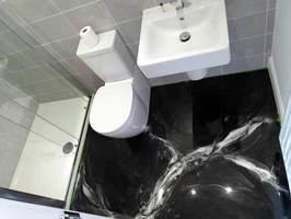 Dunkler fugenloser Epoxidharzboden im Badezimmer